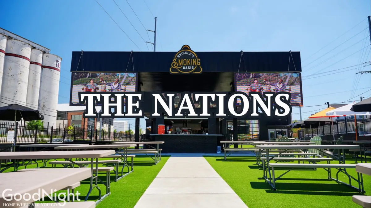 An exterior shot featuring a main building with a large sign, outdoor seating area, and green grass flooring bustling with people. The festive mood suggests a venue for live music, food festivals, and community gatherings, echoing the communal and musical spirit of Nashville.
